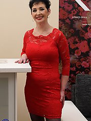 Naughty mature lady playing on her couch with herself