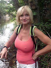 Businesswoman getting undressed