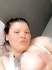 The woman is posing naked for a photo session